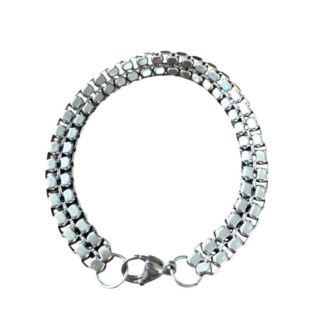 Silver bracelet with a clasp on a white background