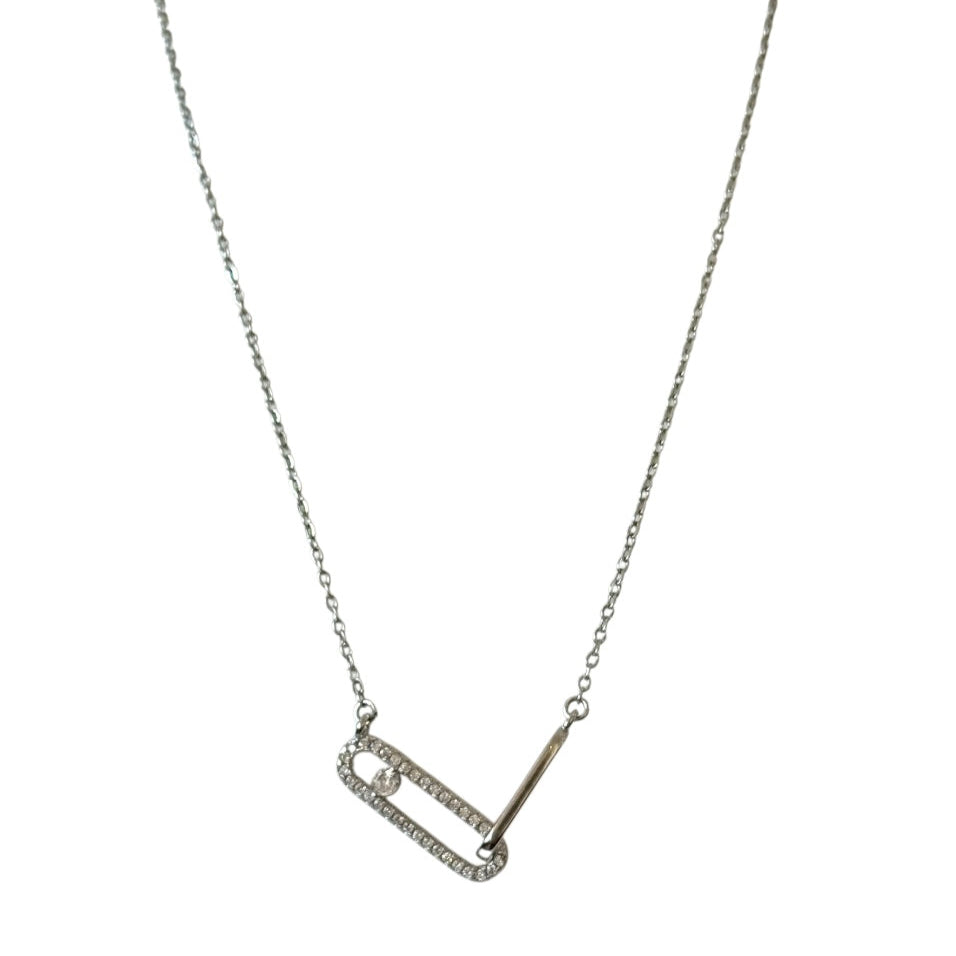 Silver necklace with a geometric pendant on a white background