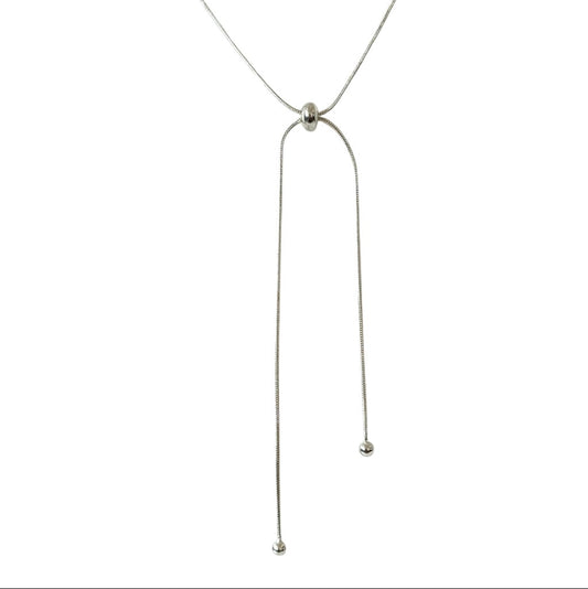 Thin silver necklace on a white background
